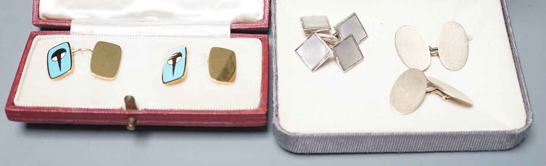 A cased pair of Garrard & Co 9ct gold and enamelled cufflinks, length 16mm, gross weight 7.8 grams, one other pair of 9ct gold and mother of pearl set cufflinks and a pair of 18ct gold oval cufflinks, 7.2 grams.